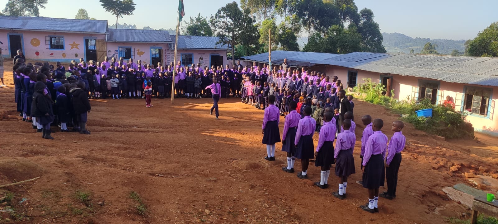 Learners of The Brightsmile Primary and Junior School at morning assembly in Kobujoi